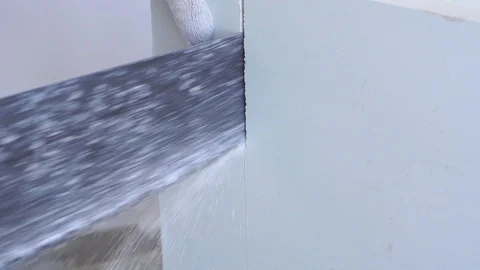 Beauty slow motion in construction and repair - male builder sawing gypsum Stock Footage 110206419