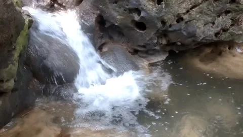 The Beauty of a Small Cascading Waterfall Stock Footage 333151043