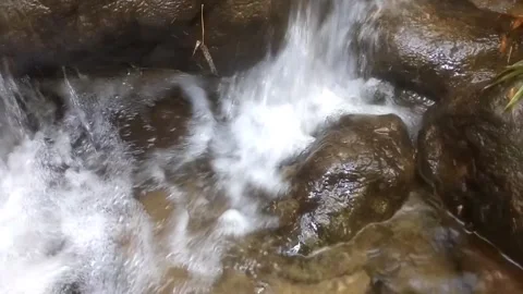 The Beauty of a Small Waterfall on Rocks Video stock 334663299