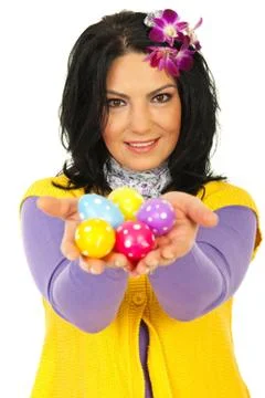 Beauty spring woman giving Easter egss Stock Photos