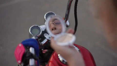 Beauty Touch Ups While on a Motorcycle Ride Through the City Streets and Nature Stock Footage 312982005