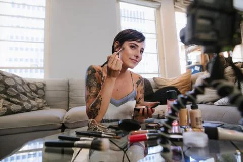Beauty vlogger making a video tutorial on makeup Stock Photos