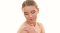 The beauty woman applying a cream on the skin on the white background 4k or 4k+ Resolution