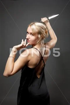 Beauty woman in evening dress with ritual knife Stock-Fotos