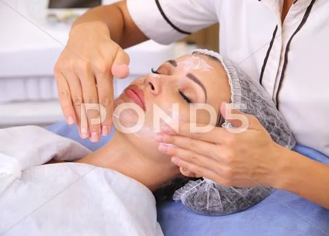 Beauty woman having cosmetic massage Stock Photos