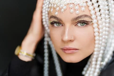 Beauty woman with make up and a wig of pearls Stock Photos