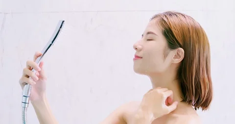 Beauty woman takes a shower Stock Footage