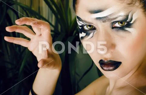 Beauty young woman with creative make up like zebra closeup, wav Stock Photos