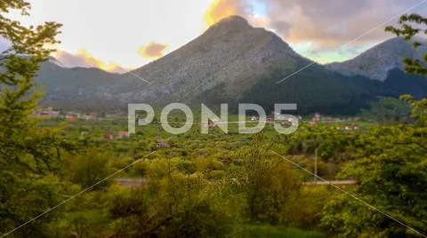Beautyfull mountain road to sunset. Road on mountain willage. Stock Photos