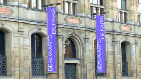 Beaux-Arts de Paris facade draped with long purple exhibition flags Stock Footage 337880637