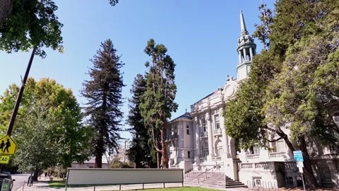 Beaux-arts style Berkeley City Hall, formerly the town hall, surrounded by lush 스톡 동영상 342898234