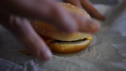 BEAVER PA - Circa March 12 2022 - Opening a Wrapped Burger King Burger Stock Footage 172066346