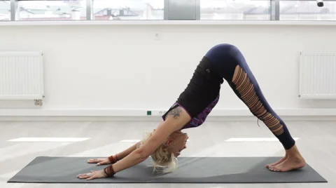 Beaytiful woman doing yoga exercise at the gym Stock Footage 66476281