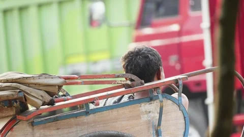 Becak Driver Waiting for Customers by Roadside Stock Footage 346015244