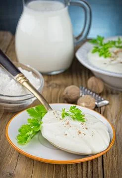 Bechamel sauce on kitchen table Stock Photos
