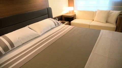 Bed and sofa in master cabin on boat Stock Footage 53431214