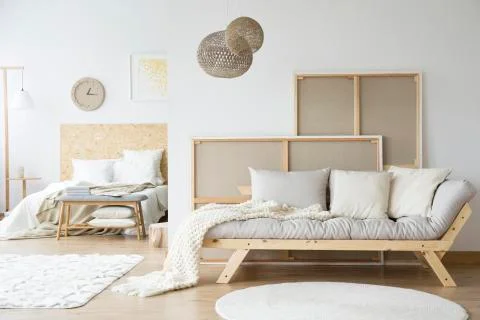 Bed and a sofa in a room Stock-Fotos