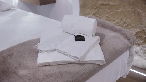 Bed with bath towels on top Stock Footage 86171686