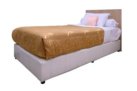 Bed with bedding and pillow isolated on white backgrounds Stock Photos