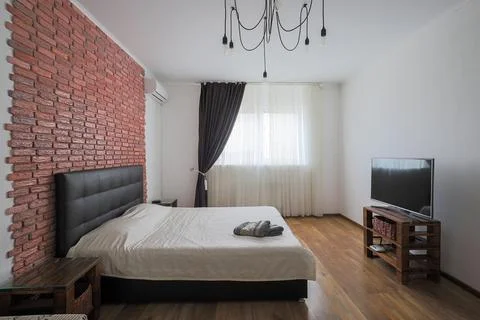 Bed in the bedroom interior Fotos Stock