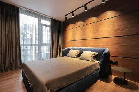 Bed in the bedroom interior Stock Photos