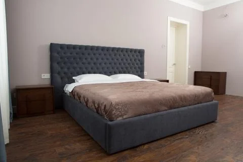Bed in bedroom Stock Photos