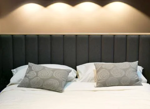 Bed in the bedroom. Stock Photos