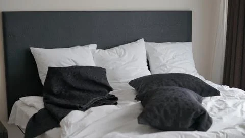 Bed in the bedroom Stock Photos