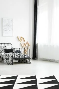 Bed with botanic bedding Stock-Fotos