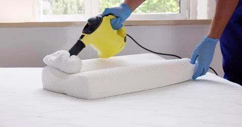 Bed Bug Pillow Pest Control Cleaning Using Steam Machine Stock Photos