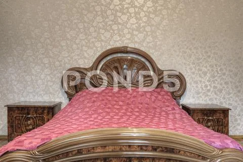 Bed With Carved Wooden Headboard