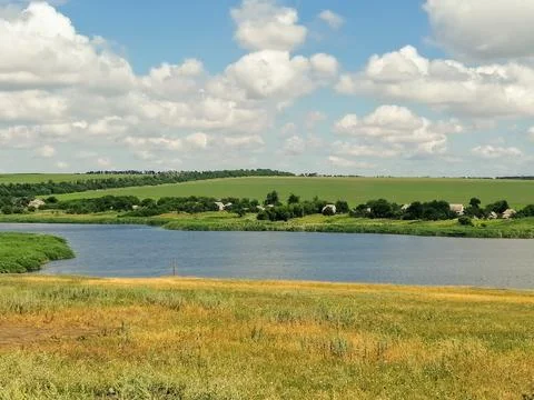 Bed of the deep river with the field and hilly background, autumn day, Ukrain Stock Photos