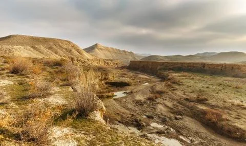 The bed of a dried-up river in the mountains Stock Photos