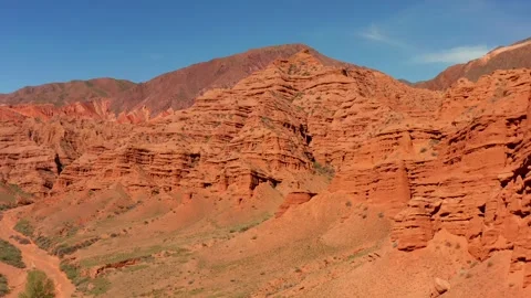 The bed of a dried-up river. Rocky columns of red sandstone. Stock Footage 276645368