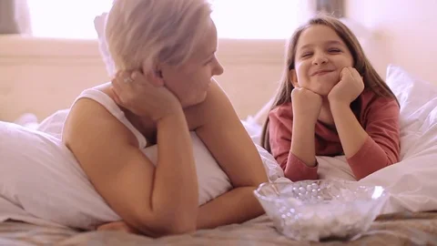On the bed eating marshmallow Stock-Footage 74635598