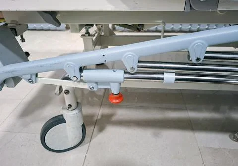Bed frame part in a hospital setting with focus on latch during a daytime shi Stock-Fotos