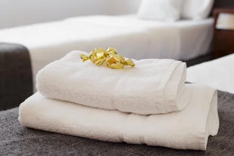 Bed with fresh towels Stock Photos