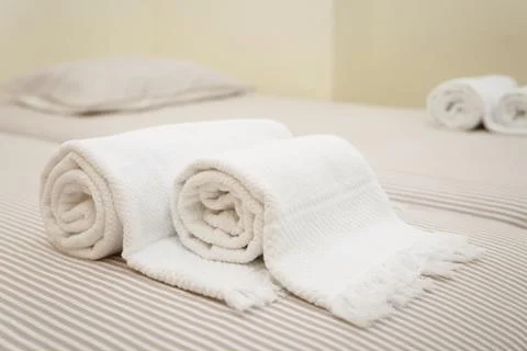 Bed with fresh towels Stock Photos