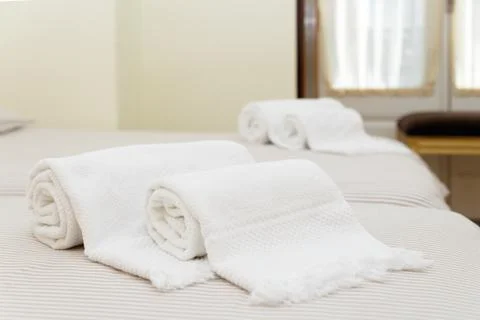 Bed with fresh towels Stock Photos