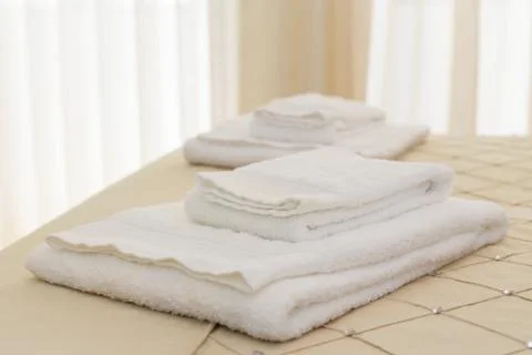Bed with fresh towels Stock Photos