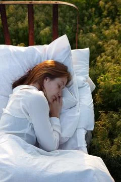 Bed in a green field Stock Photos