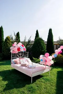 A bed on green grass Stock Photos