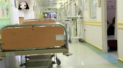Bed in hospital corridor Stock Footage 63159770