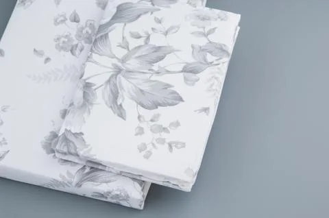 Bed linen on grey background Stock Photos
