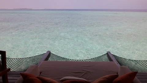 Bed overlooking the ocean in the Maldives Stock Footage 244150333