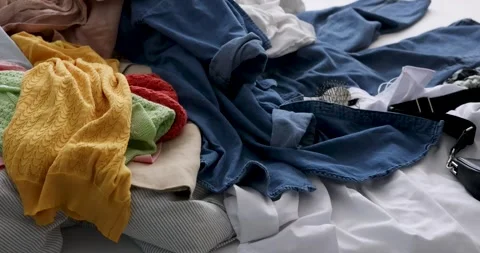 Bed with a Pile of Clothes. Stock Footage 277969396