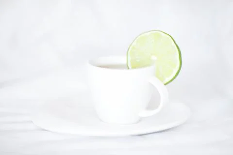 Bed with a pillow and a cup of tea Stock Photos