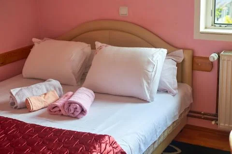 Bed, pillows and sheets Stock Photos