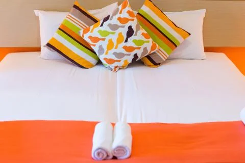 Bed with pillows Stock Photos