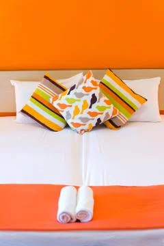 Bed with pillows Stock Photos